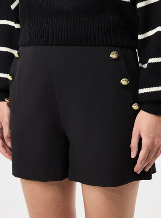 Shorts tinta unita con bottoni applicati