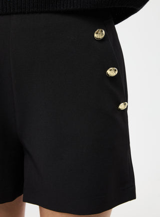 Shorts tinta unita con bottoni applicati