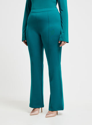 Pantaloni a zampa tinta unita