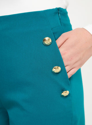 Shorts tinta unita con bottoni applicati