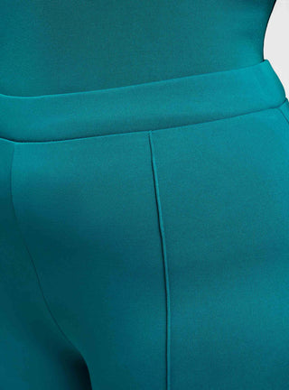 Pantaloni a zampa tinta unita